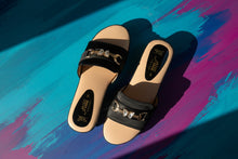 Load image into Gallery viewer, Black sandals with decorative chain on a concrete surface