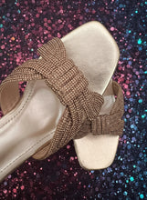 Load image into Gallery viewer, Gold sandal with a decorative bow on a dark background