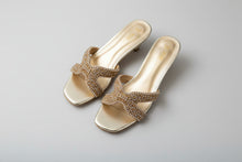 Load image into Gallery viewer, Gold embellished sandals on a gray surface