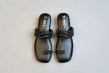 Load image into Gallery viewer, Black sandal with glittery strap on a beige surface