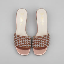 Load image into Gallery viewer, Pair of brown and white patterned sandals on a gray surface