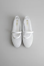 Load image into Gallery viewer, Pair of white shoes with decorative straps on a gray tiled floor