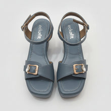 Load image into Gallery viewer, Pair of blue sandals with buckles on a gray surface