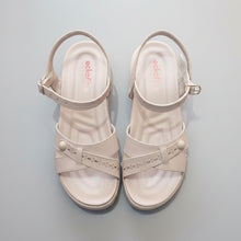 Load image into Gallery viewer, Pair of beige sandals on a gray surface