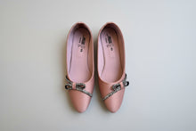 Load image into Gallery viewer, Pair of pink shoes with decorative buckles on a concrete floor.