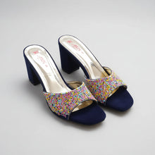 Load image into Gallery viewer, Pair of black high-heeled shoes with colorful embellishments on a gray surface
