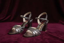 Load image into Gallery viewer, Pair of silver high-heeled shoes on a gray surface
