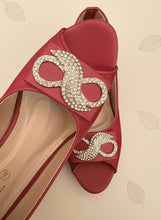 Load image into Gallery viewer, Red shoe with gold embellishments on a dark background
