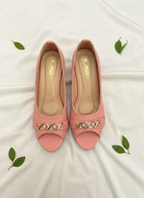 Load image into Gallery viewer, Pair of pink open-toe shoes with decorative gold accents on a dark background
