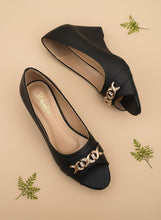 Load image into Gallery viewer, Black sandals with gold chain detail on a dark background
