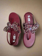 Load image into Gallery viewer, Maroon sandals with butterfly embellishments on a gray surface
