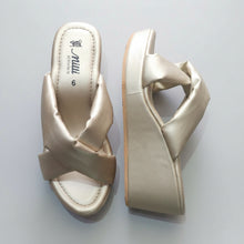 Load image into Gallery viewer, A pair of women's platform wedge sandals in a champagne satin fabric, shown from both the top and side profiles on a gray stone-textured surface. The insole displays the brand 'miu miu'.
