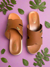 Load image into Gallery viewer, Pair of brown sandals on a gray concrete surface
