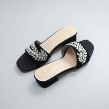Load image into Gallery viewer, Black sandals with crystal embellishments on a gray surface
