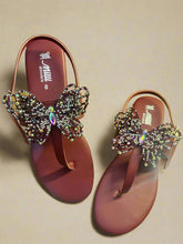 Load image into Gallery viewer, Pair of maroon sandals with decorative butterfly embellishments on a wooden surface.
