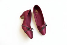 Load image into Gallery viewer, Maroon high-heeled shoes with embellishments on a gray surface
