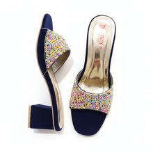 Load image into Gallery viewer, Navy high-heeled shoes with colorful bead embellishments on a gray surface
