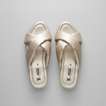 Load image into Gallery viewer, A pair of satin slide sandals in a champagne beige color, displayed on a gray marbled surface. The brand name 'miu miu shoes' is visible on the insoles.
