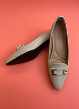 Load image into Gallery viewer, Pair of beige shoes with decorative gold accents on a gray surface
