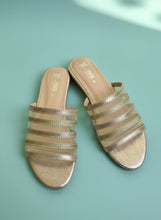 Load image into Gallery viewer, Pair of gold and beige striped sandals on a gray surface
