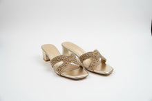 Load image into Gallery viewer, Gold high-heeled shoes with embellishments on a gray surface
