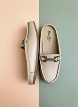 Load image into Gallery viewer, Pair of beige loafers with a decorative buckle on a gray surface
