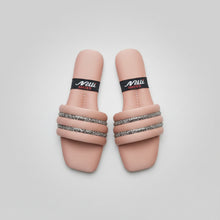 Load image into Gallery viewer, Pair of pink sandals with decorative straps on a gray surface
