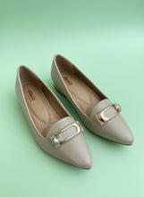 Load image into Gallery viewer, Pair of light-colored shoes with decorative buckles on a neutral background
