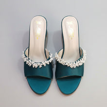 Load image into Gallery viewer, Teal high-heeled shoes with pearl embellishments on a gray surface
