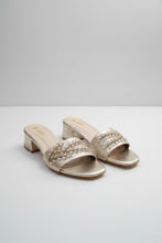 Load image into Gallery viewer, Pair of silver high-heeled shoes with embellishments on a gray marble surface
